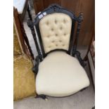 A VICTORIAN EBONISED NURSING CHAIR