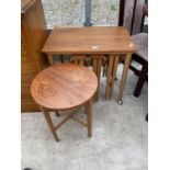 A RETRO TEAK COFFEE TABLE ENCLOSING A NEST OF FOUR SMALL DROP LEAF TABLES