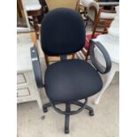 A MODERN BLACK OFFICE SWIVEL ARM CHAIR