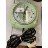 A SMITHS GREEN DECO STYLE ELECTRIC WALL CLOCK