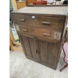 AN OAK TALLBOY WITH TWO DOORS AND TWO DRAWERS