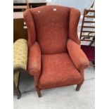 A GEORGE III STYLE WING BACK ARMCHAIR