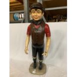 A MODEL OF A BOY IN FLAT CAP