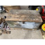 A WOODEN TOOL CHEST