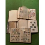 FIVE STAMP ALBUMS TO INCLUDE A LARGE QUANTITY OF VARIOUS STAMPS