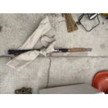 A THREE PIECE SPLIT CANE BOAT ROD