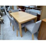 A MODERN RECTANGULAR OAK DINING TABLE AND SIX CHAIRS