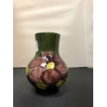 A MOORCROFT GREEN VASE