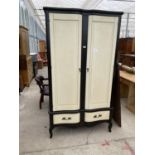 A BLACK AND WHITE WARDROBE WITH TWO DOORS AND TWO DRAWERS