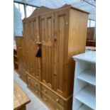 A [PINE WARDROBE WITH TWO DOORS AND FOUR DRAWERS