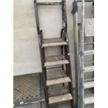 TWO SETS OF VINTAGE TUBULAR METAL STEPLADDERS