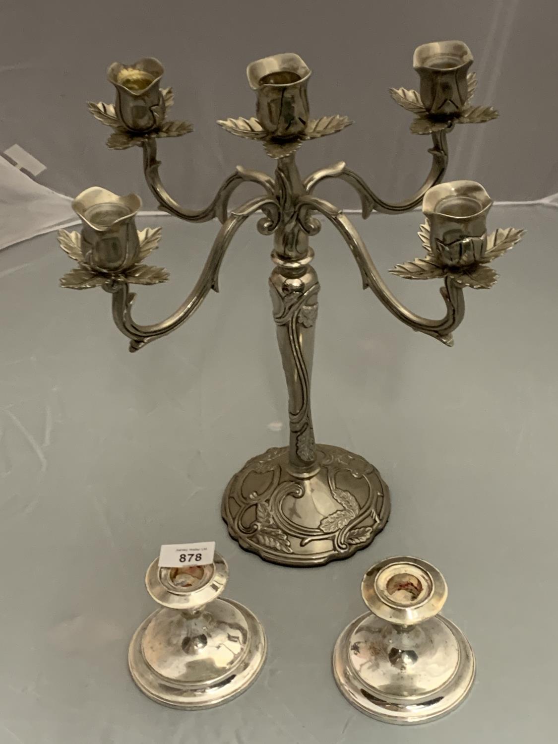 AN ORNATE SILVER PLATE CANDELABRA AND TWO CANDLESTICKS