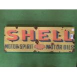 A VINTAGE STYLE RUST METAL SHELL MOTOR SPIRIT OIL SIGN