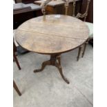 A GEORGE III OAK TRIPOD TABLE