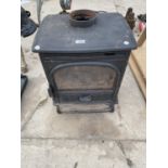 A CAST IRON WOOD BURNER STOVE