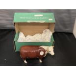 A BESWICK HEREFORD COW WITH BOX