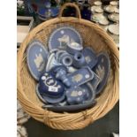 A BASKET OF NUMEROUS BLUE AND WHITE WEDGEWOOD JASPERWARE ITEMS