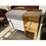 A SMALL PAINTED CHEST OF DRAWERS AND AN OPEN BOOKCASE