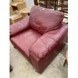 A MAROON LEATHER EASY CHAIR