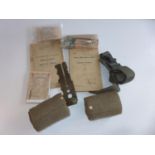 A MEDICAL DECONTAMINATION KIT, BANDAGE, TWO PAIRS OF PUTTEES, BOOKLETS, WWII TOURNIQUET ETC
