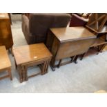 A NEST OF THREE OAK TABLES AND AN OAK DROP-LEAF TABLE