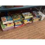 A LARGE QUANTITY OF JIGSAWS AND VINTAGE BOARD GAMES