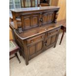 AN ERCOL COURT CUPBOARD, 48" WIDE