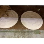 A PAIR OF LARGE ROUND WHITE PLASTER PLAQUES IN A FLORAL STYLE