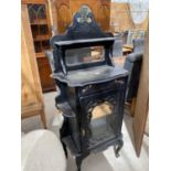 A VICTORIAN EBONISED, GLAZED AND MIRROR BACK CABINET, 29" WIDE