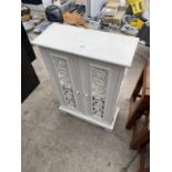 A SMALL DECORATIVE WHITE CABINET WITH TWO DOORS