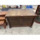 A PANELED OAK BLANKET CHEST