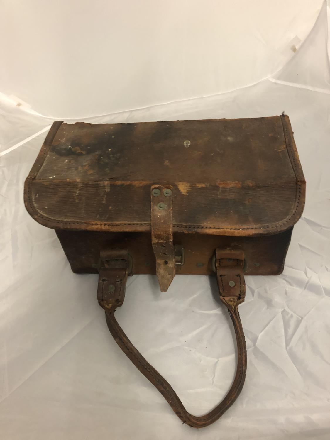 A BROWN LEATHER MILITARY BOX DATED 1954