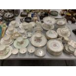 AN EXTENSIVE COLLECTION OF FLORAL DECORATED TEA WARE INCLUDING CAKE STANDS