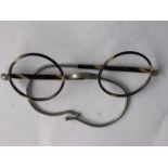 A VINTAGE PAIR OF TORTOISE SHELL SPECTACLES