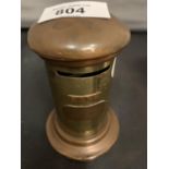 A SMALL BRASS AND COPPER POST BOX MONEY BOX