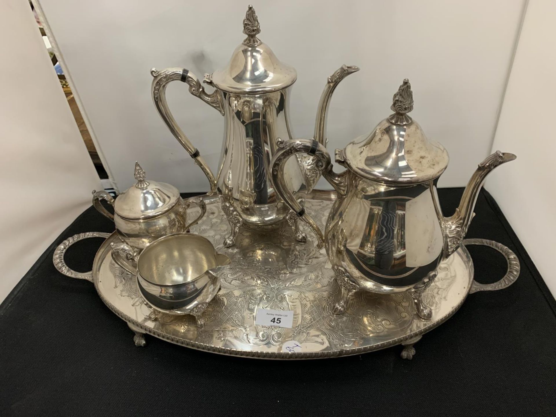 A FOUR PIECE SILVER PLATED TEA AND COFFEE SET ON MATCHING TRAY