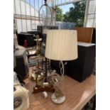 THREE TABLE LAMPS TO INCLUDE AN IRON AND WOOD EXAMPLE WITH CLAW FEET, A HEAVY BRASS LAMP AND FURTHER