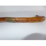 A CARVED STICK WITH INSCRIPTION WESTWALL 1939-40, THE WESTWALL ALSO KNOWN AS THE SIEGFRIEU LINE