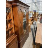 AN INLAID MAHOGANY WARDROBE WITH SINGLE BEVEL EDGE MIRRORED DOOR