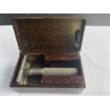 A VINTAGE BAKERLITE BOX WITH A GILLETTE RAZOR AND SPARE BLADE BOXES