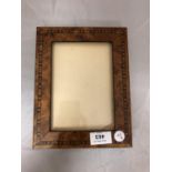 AN INLAID WOODEN PHOTOGRAPH FRAME (GLASS A/F)