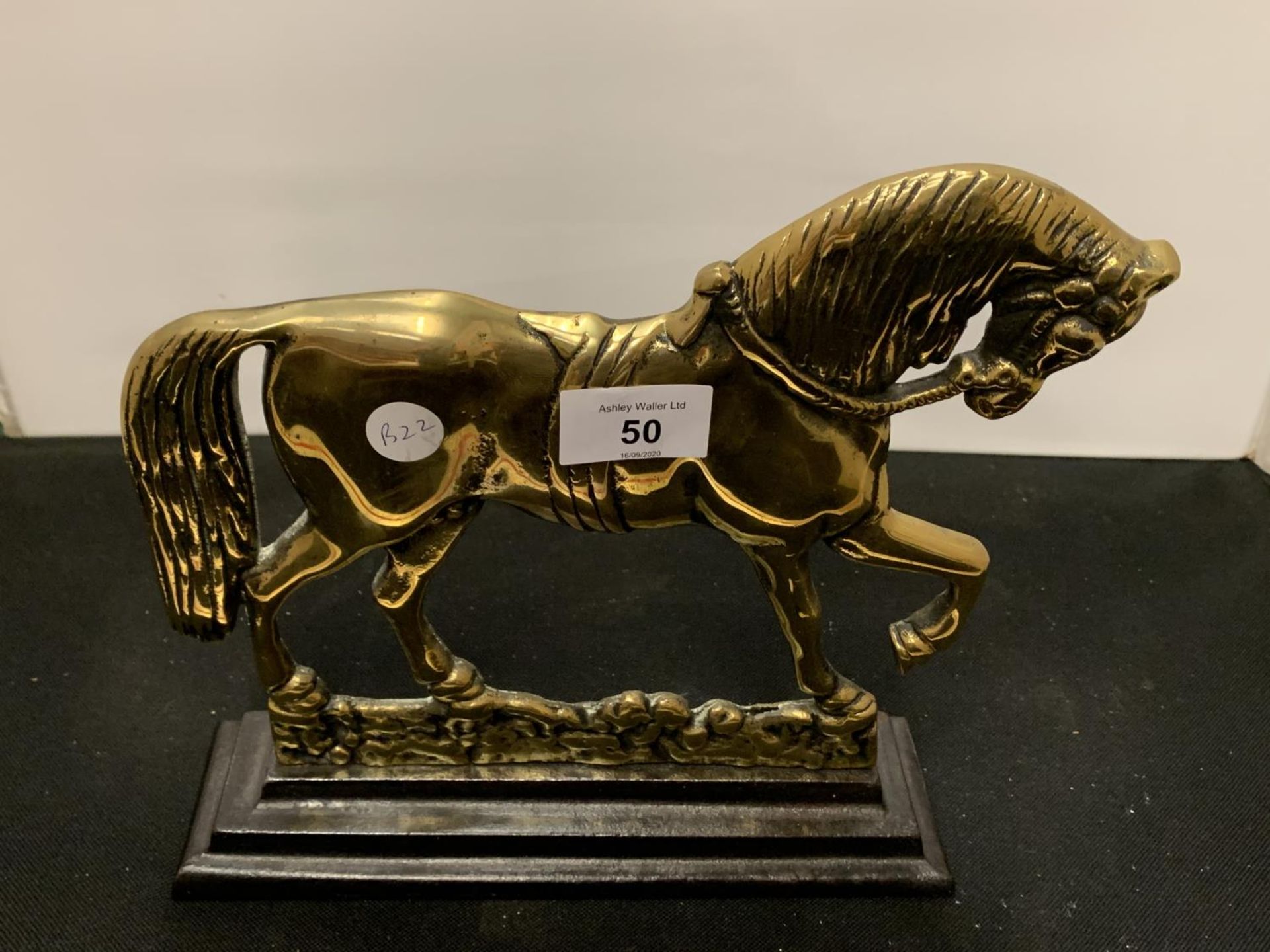 A BRASS HORSE DOORSTOP