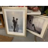 A PAIR OF LARGE JACK VETTRIANO PRINTS, LADY BEFORE A WINDOW AND COUPLES DANCING ON THE SHORE