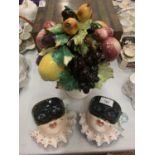 A TRIO OF ITALIAN CERAMICS COMPRISING OF TWO PIERROT WALL PLAQUES AND A VASE OF EXOTIC FRUIT