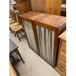 A MAHOGANY TWO DOOR CABINET