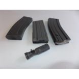 THREE MAGAZINES AND A BULLET DAMAGED GUN MUZZLE