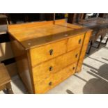 A SATINWOOD CHEST OF TWO LONG AND TWO SHORT DRAWERS