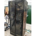 A METAL TWO DOOR CABINET