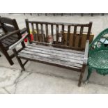 A WOODEN GARDEN BENCH SEAT