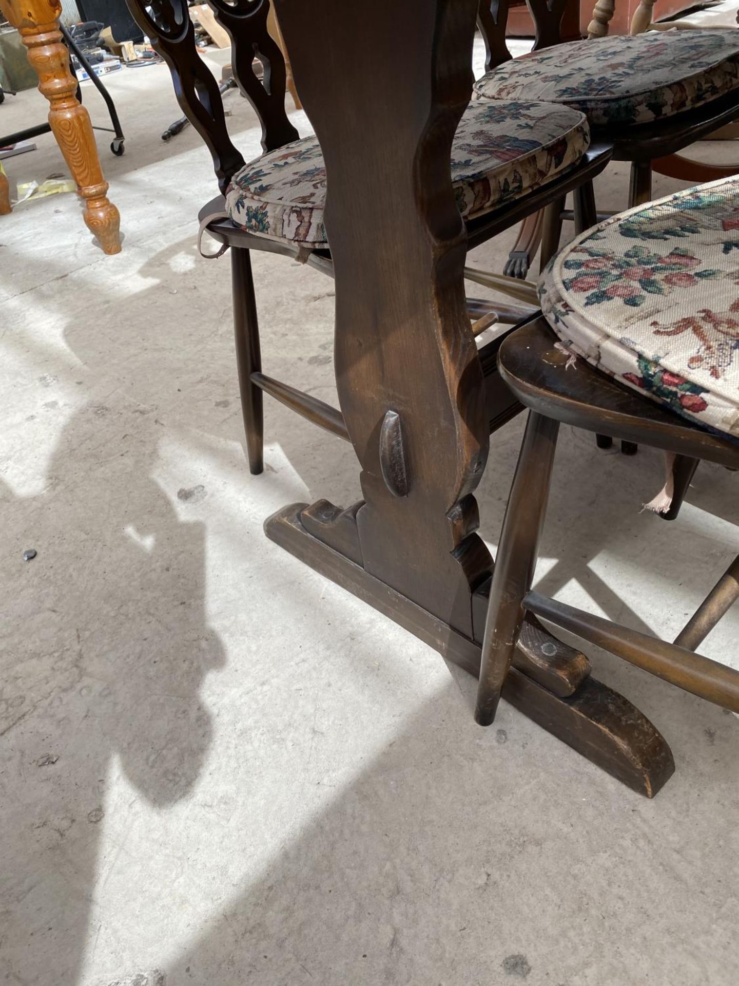 AN ERCOL REFECTORY DINING TABLE AND FOUR CHAIRS - Image 3 of 8